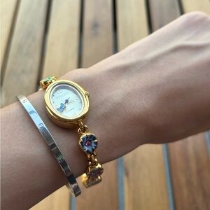 Joan Rivers vintage gold tone watch with colorful flower and butterfly charms.